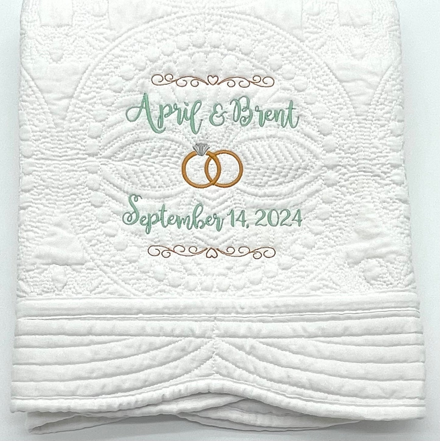 Personalized Wedding Heirloom Quilt Blankets - Custom embroidered with names, date and wedding rings. Border color options include pink, blue, white, green & purple. The perfect wedding, engagement or shower gift!