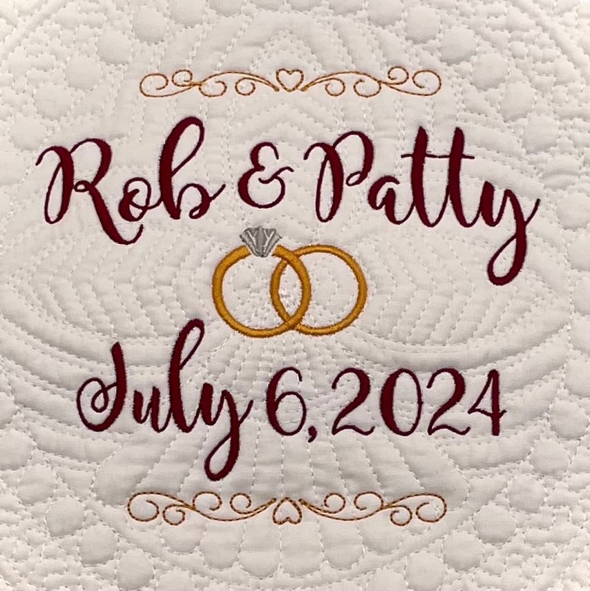 Personalized Wedding Heirloom Quilt Blankets - Custom embroidered with names, date and wedding rings. Border color options include pink, blue, white, green & purple. The perfect wedding, engagement or shower gift!