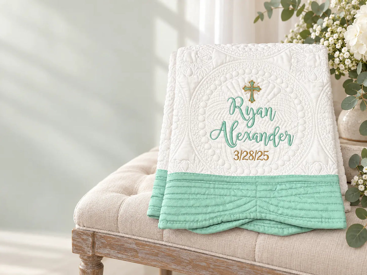 Personalized mint baptism quilt embroidered with a cross, name, and date